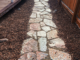 Flagstone Pathway By Fence